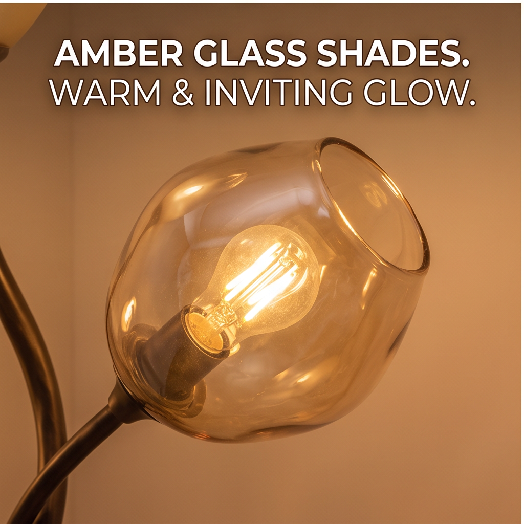Close-up of an amber glass shade on the branch floor lamp with a glowing bulb